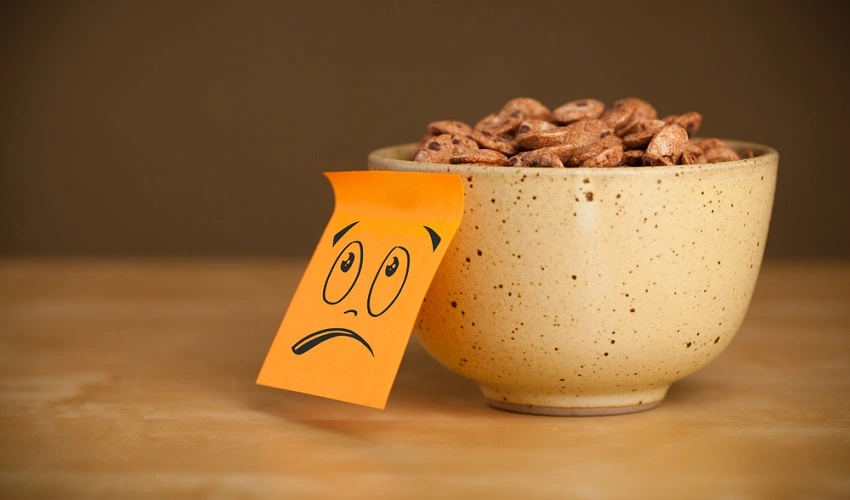 Drawn smiley face on a post-it note placed on a cereal bowl