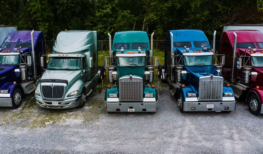 Multicolor freight trucks in a row